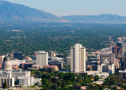 A city with mountains in the background.