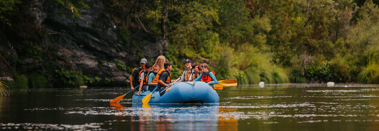 A group of people in a canoe.