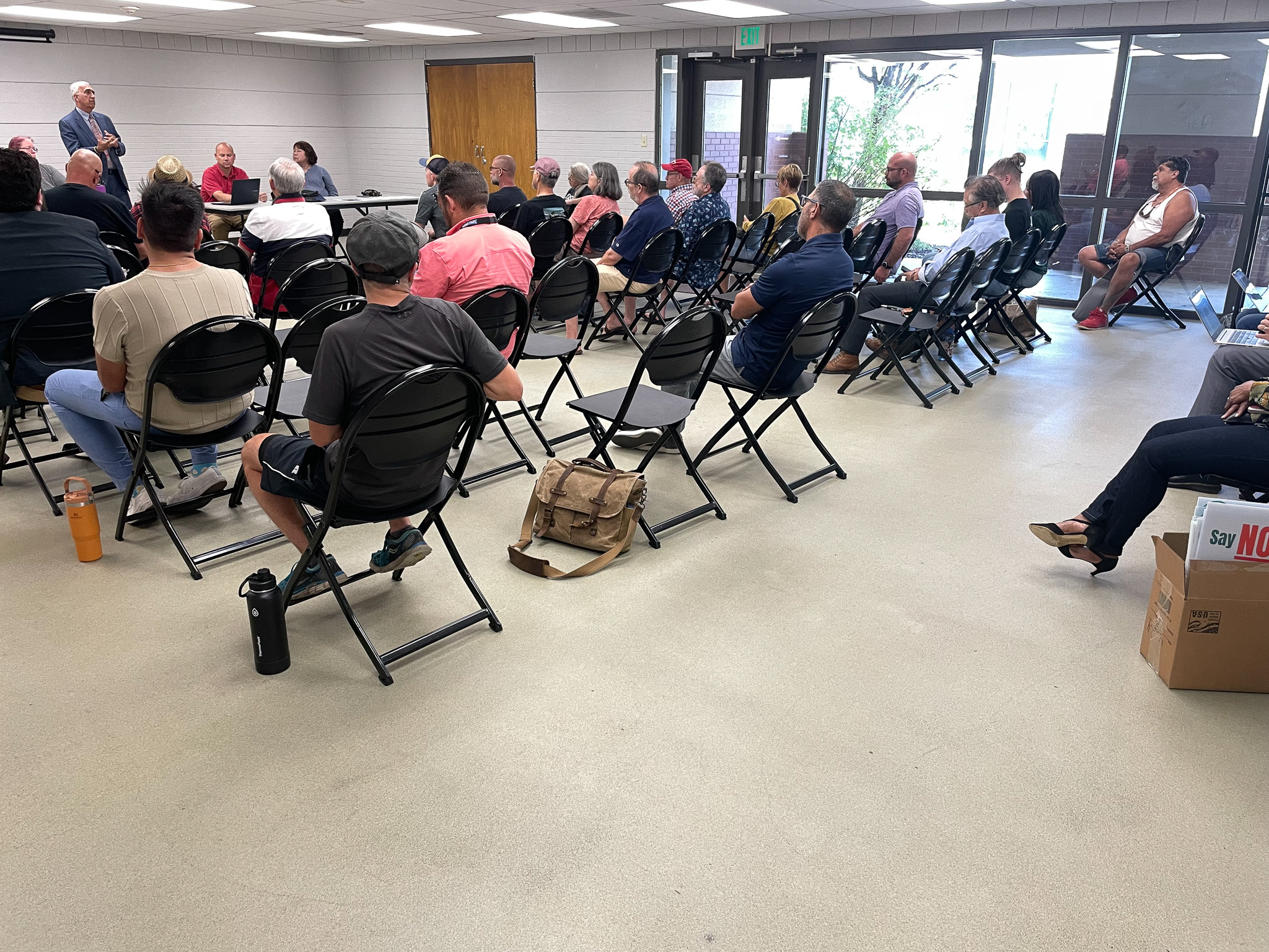 A group of people sitting in chairs.