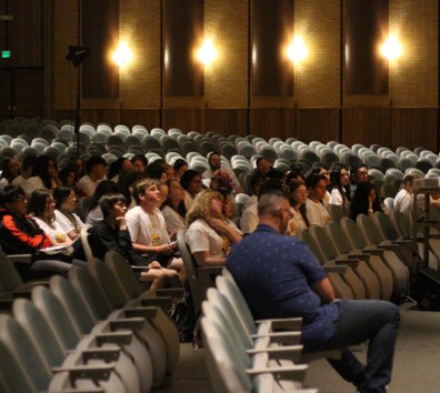 A group of people sitting in a room.