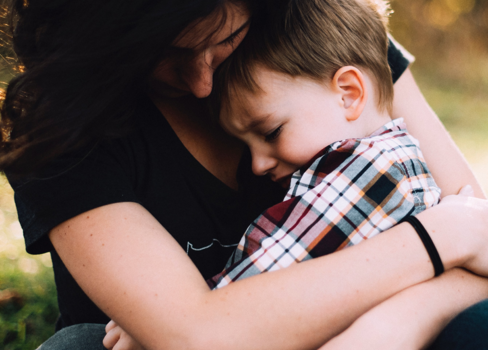 A person kissing a child.