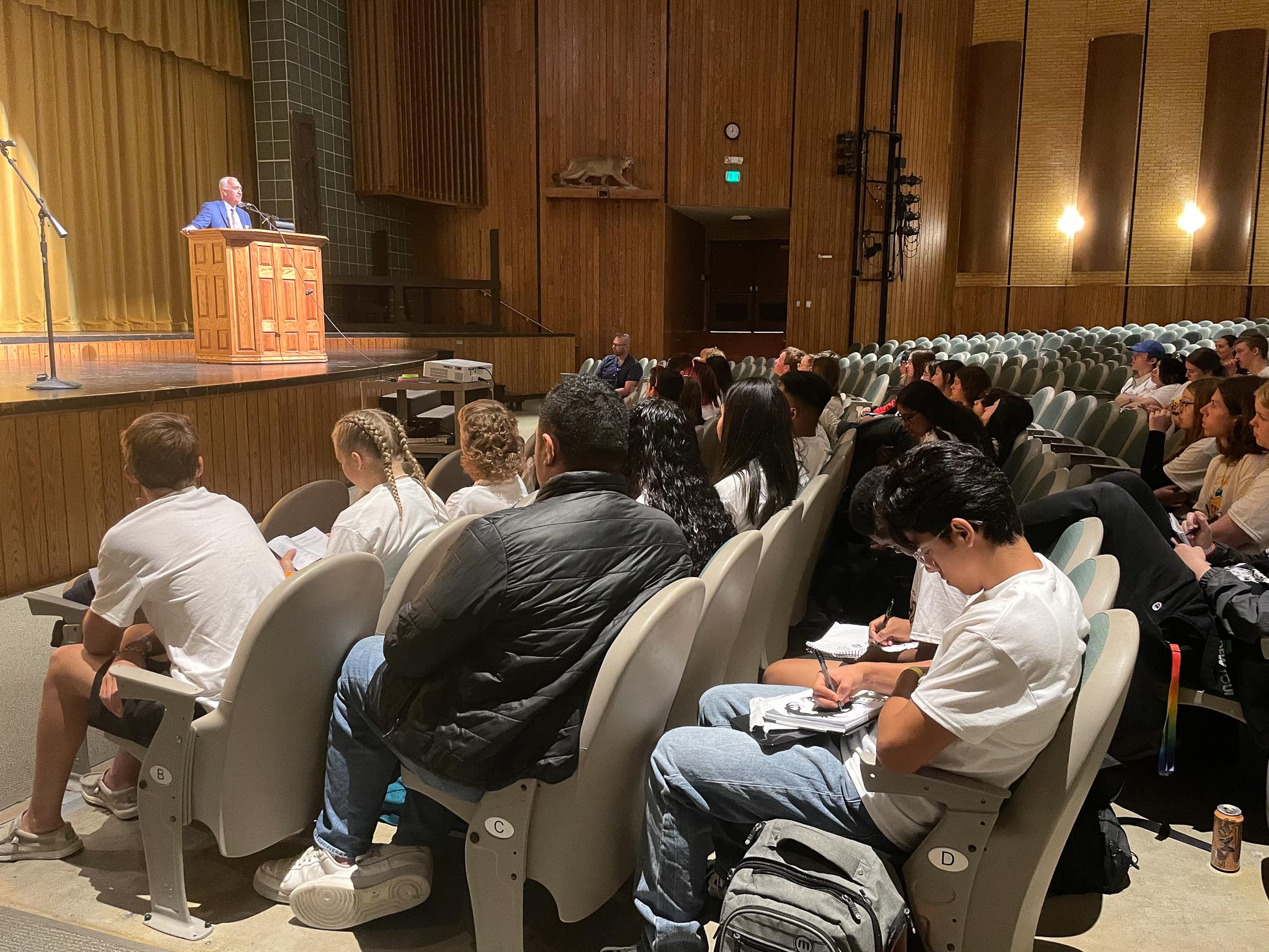 A group of people sitting in chairs.