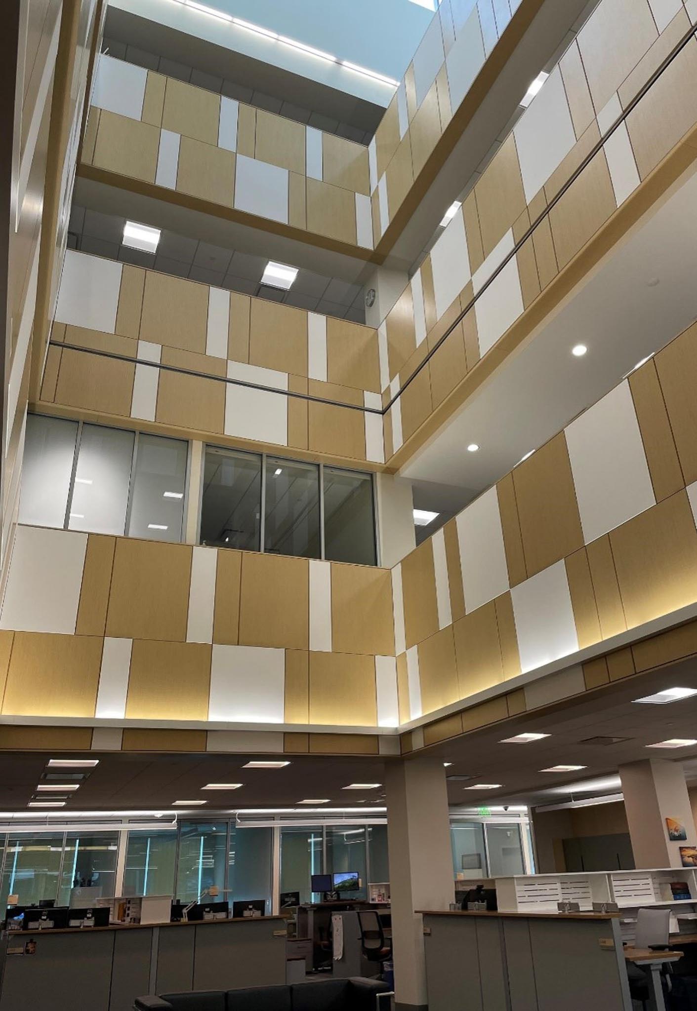 A room with a large ceiling and many windows.