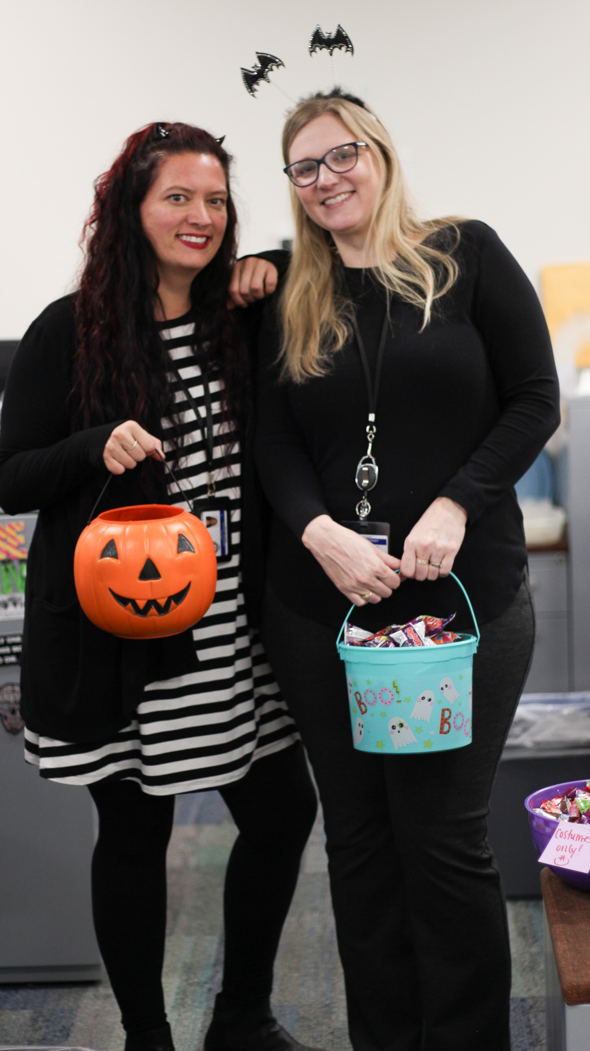 Two women holding a box.