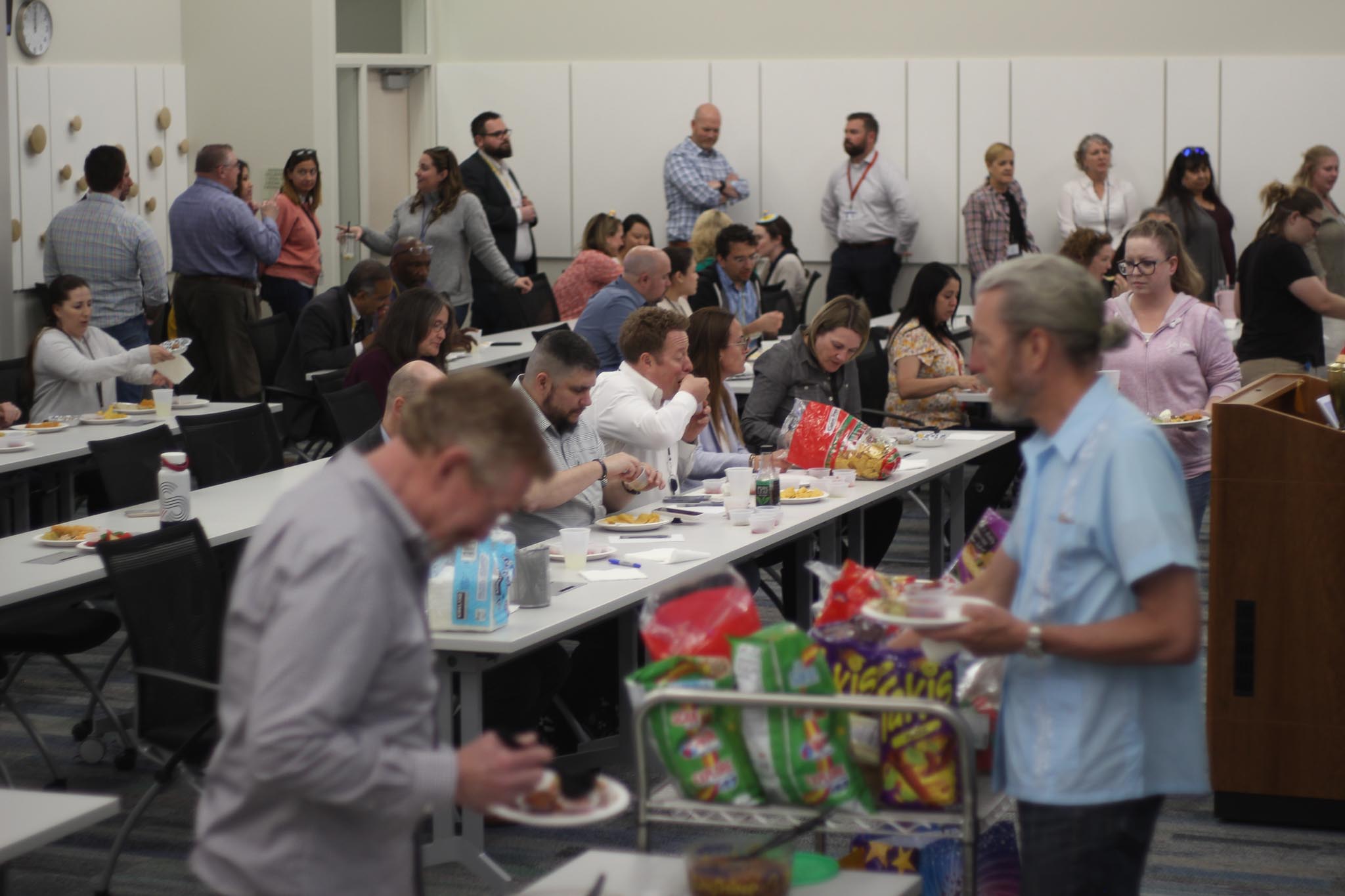 A group of people in a room.