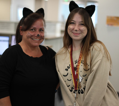 A couple of women smiling.
