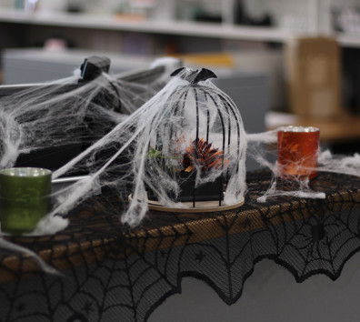 A glass of liquid and a bag of ice on a table.
