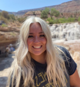 A woman smiling for the camera.