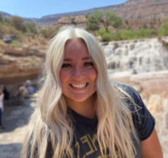 A woman smiling for the camera.