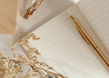 A gold cross on a white surface.