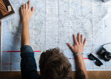 A person writing on a whiteboard.