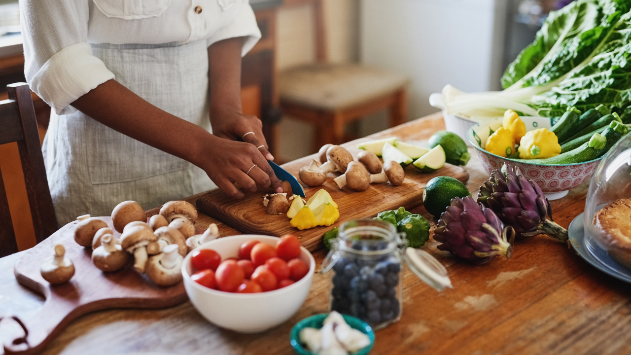 A person cutting vegetables.