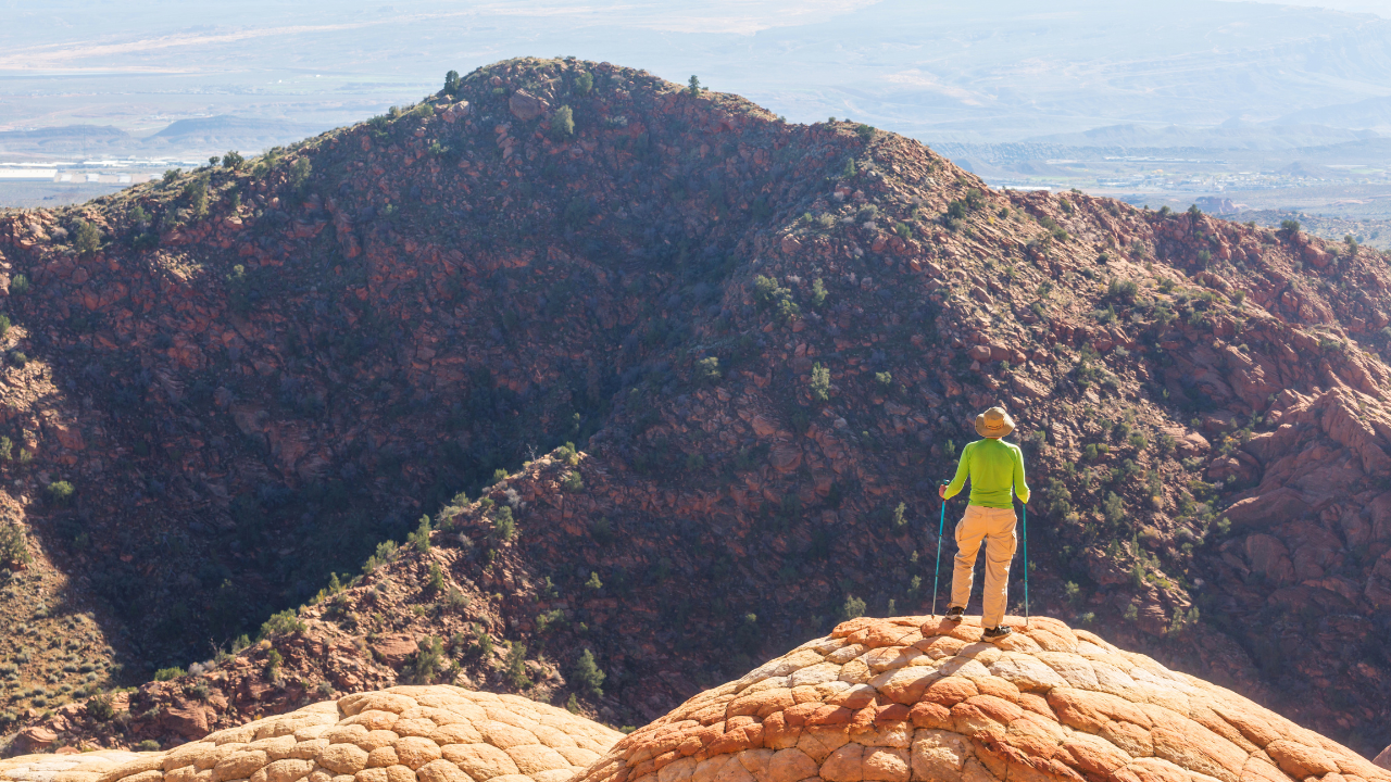 A person standing on a rock.