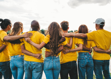 A group of people in yellow t-shirts.