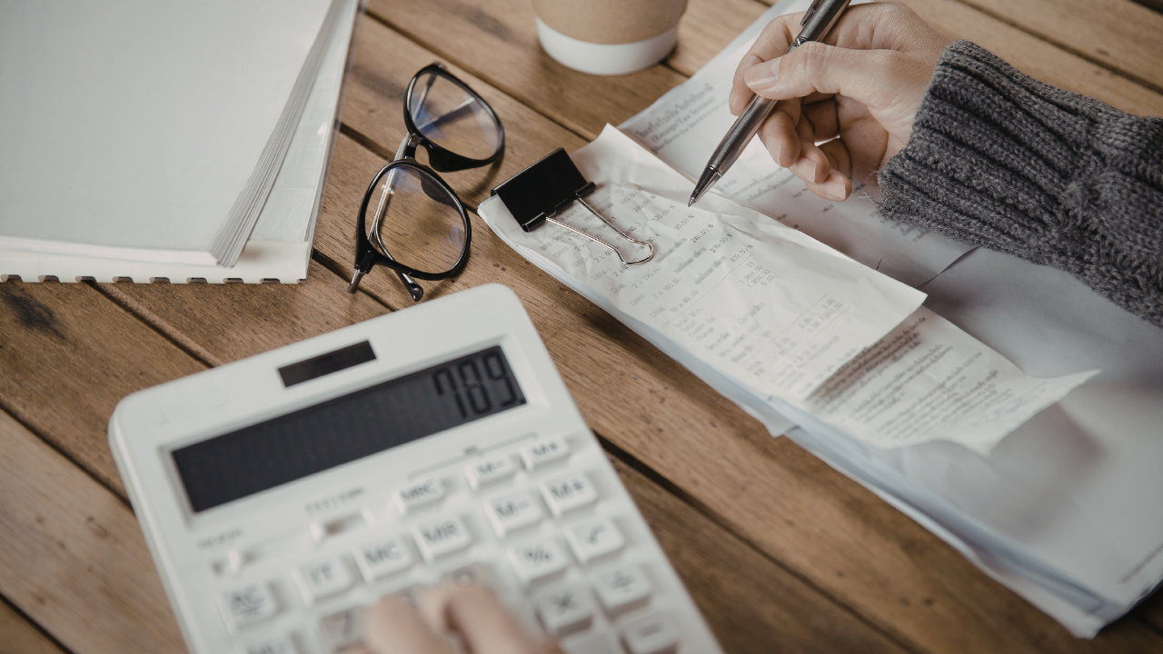 A person writing on a piece of paper.