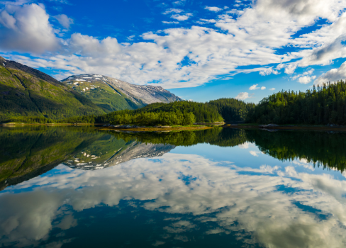 A lake with mountains in the background.