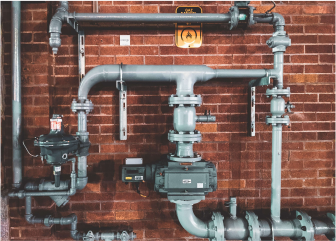A brick wall with pipes and pipes.