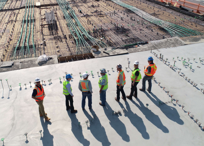 A group of people standing on a snowy hill.