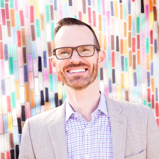 A man wearing glasses.