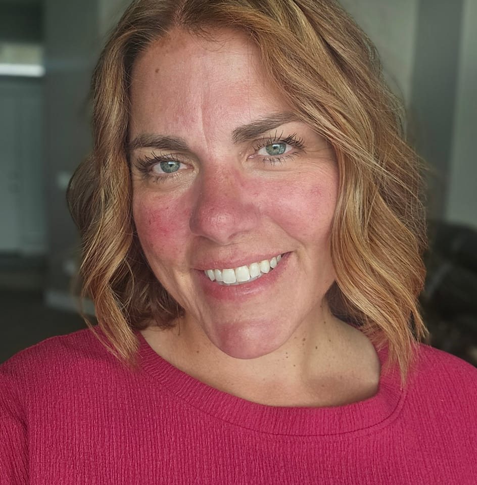 A close-up of a person smiling.