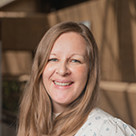 A woman smiling at the camera.