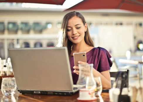 A woman using a laptop.