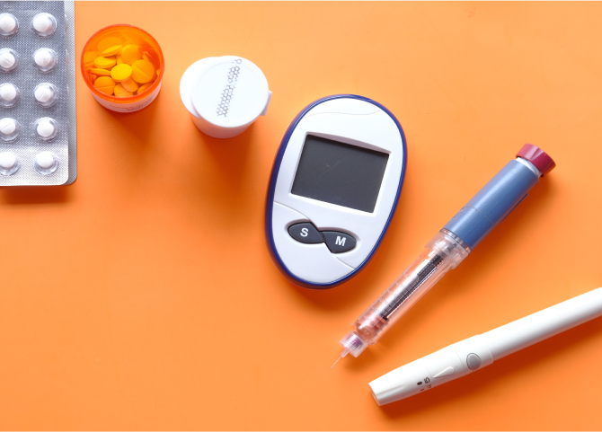 A cell phone and a pen on a table.