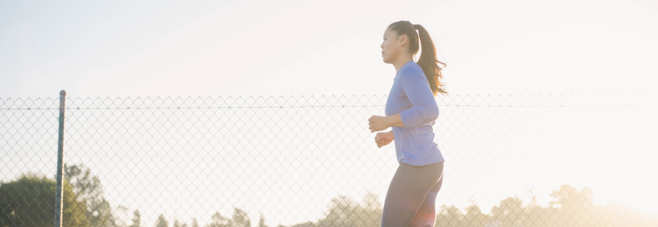 A woman running on a track.