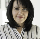 A woman with dark hair.