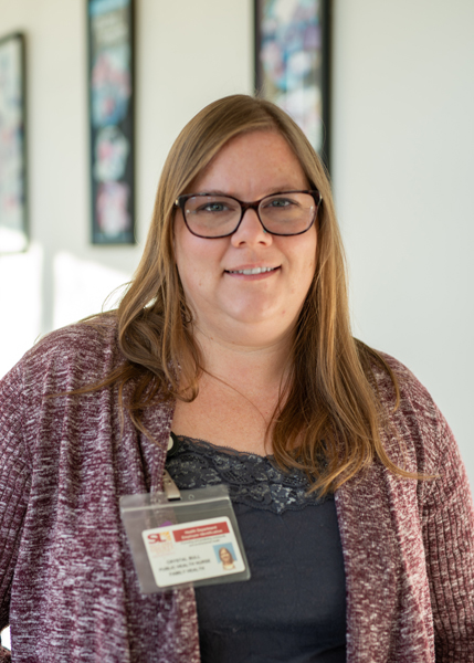 A woman wearing glasses.