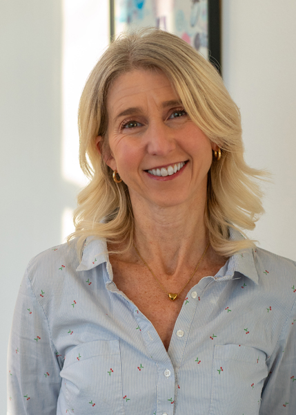 A woman smiling for the camera.