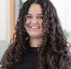A person with curly hair.