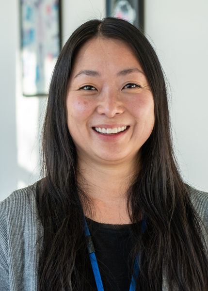 A woman smiling for the camera.