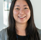 A woman smiling for the camera.