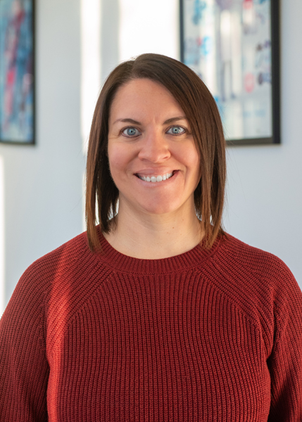 A woman smiling for the camera.