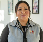 A woman smiling for the camera.