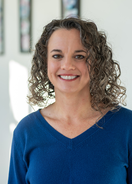 A person with curly hair.