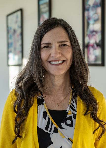 A woman smiling for the camera.
