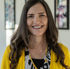 A woman smiling for the camera.