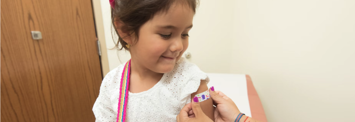 A girl holding a book.