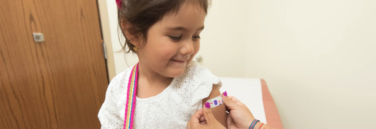 A girl holding a book.