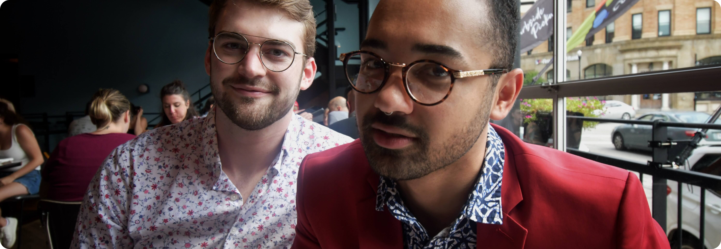 A couple of men posing for the camera.