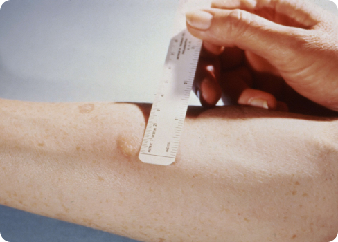 A person holding a measuring tape.