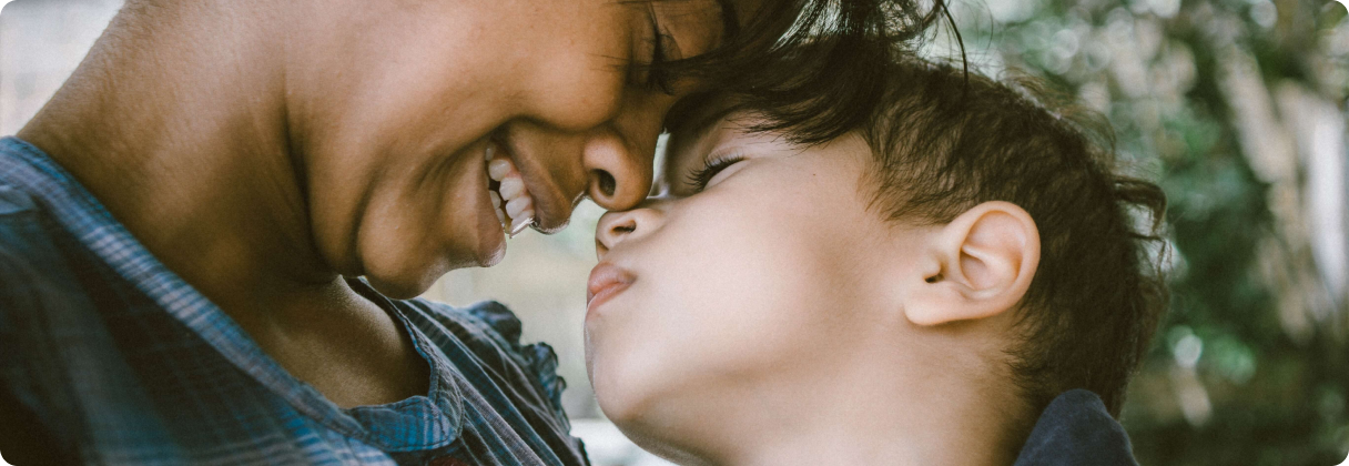 A man and a woman kissing.