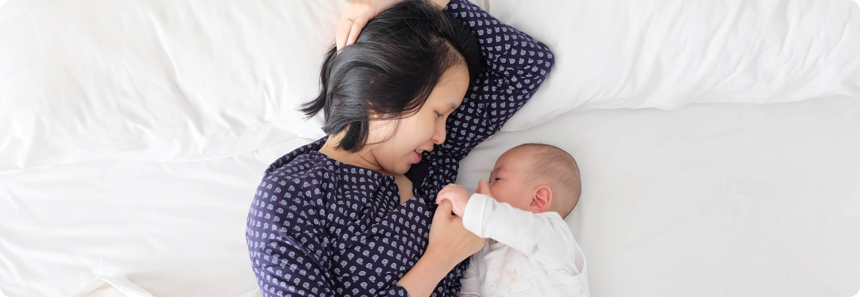 A person holding a baby.