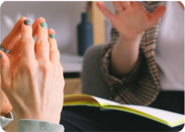 A person holding the hands up.