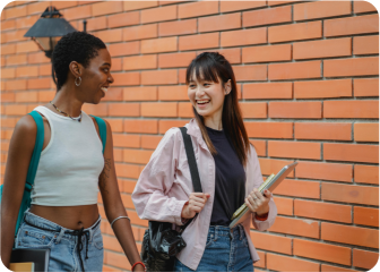 A couple of women looking at a tablet.