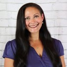 A woman smiling for the camera.