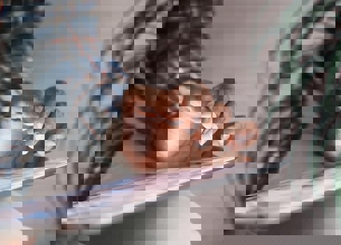 A person's feet on a book.