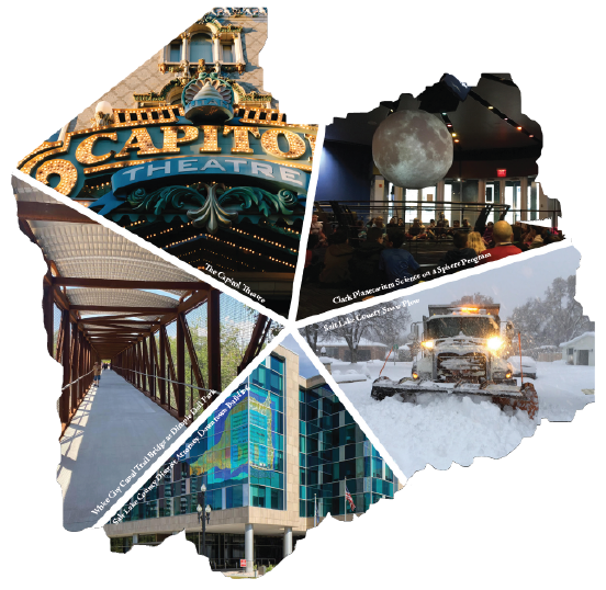 A building with a tower and a snow covered ground.